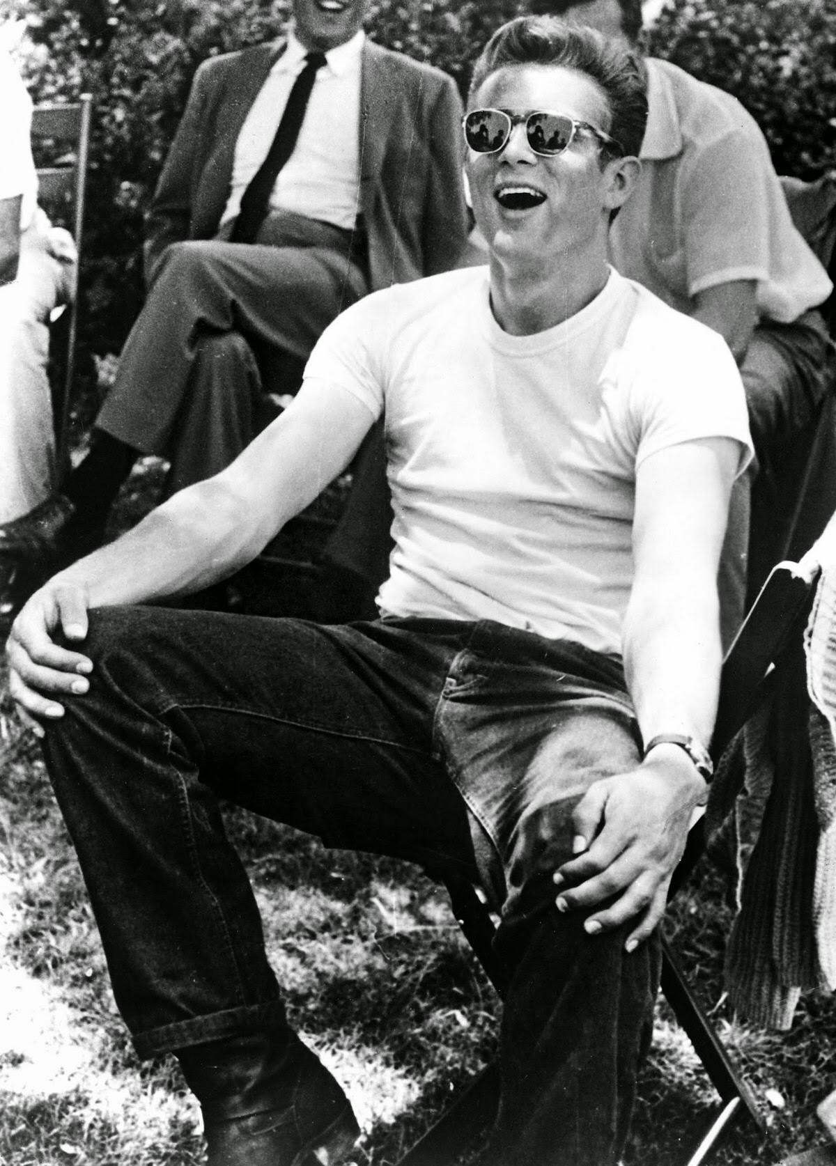 James Dean wore his t-shirt without anything covering it in Rebel without a Cause.