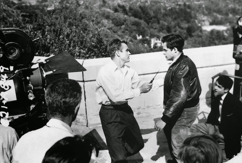 James Dean and Corey Allen (as troublemaker Buzz Gunderson) film the thrilling knife-fight scene on the terrace of the Griffith Observatory in Los Angeles.