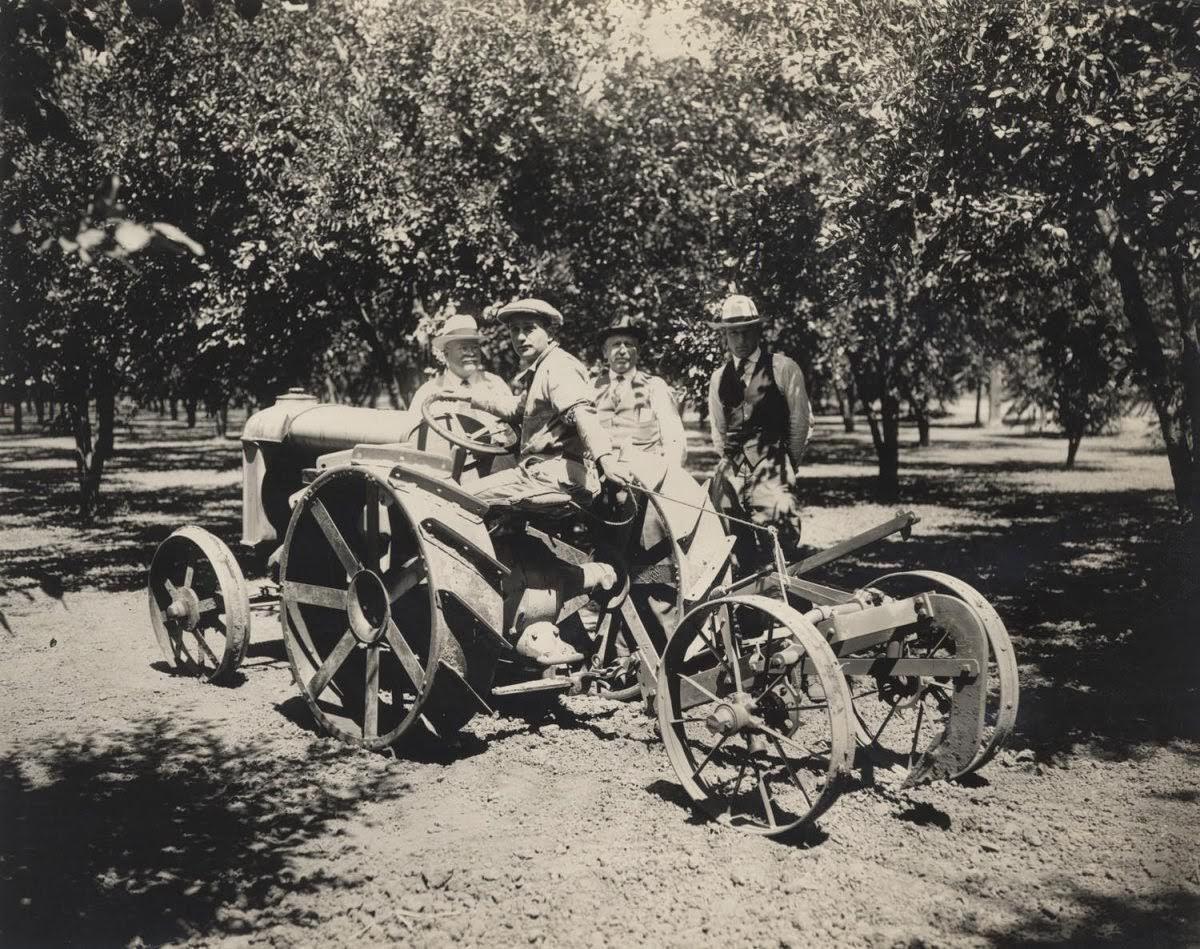 Men posed with a trenching machine made by the Knapp Plow Company