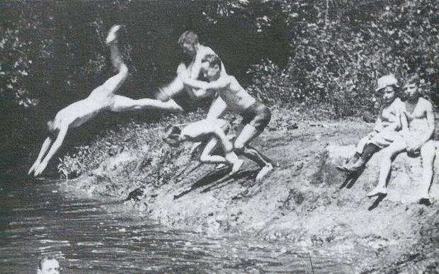 Youngsters dive into the Rahway River from the riverbank in Cranford, 1891