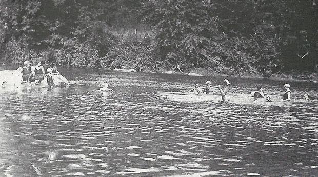 Young man performing water ballet in the Newark Bay near Bayonne, 1915