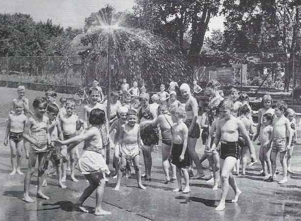 The playground program at the Lafayette School in Highland Park featured an outdoor sprinkler, 1948