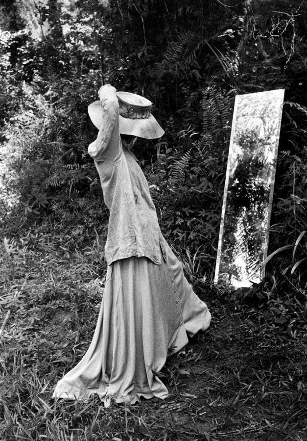 Katharine Hepburn adjusts her costume before a full-length mirror which was soon broken.