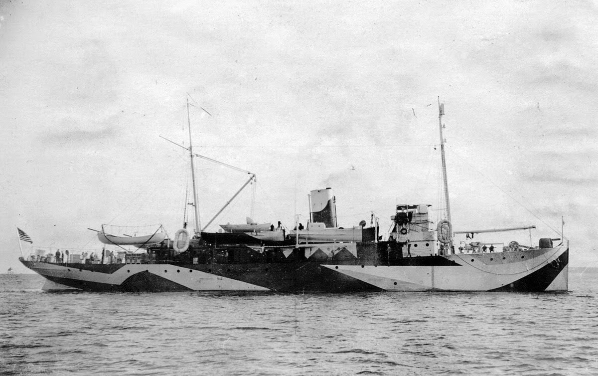 The USS Fulton (AS-1), an American submarine tender painted in Dazzle camouflage, in the Charleston South Carolina Navy Yard, November 1918.