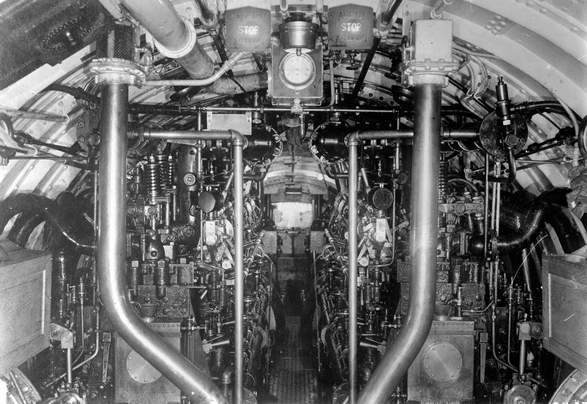 The complex inner machinery of a U.S. Submarine, amidships, looking aft, 1918.