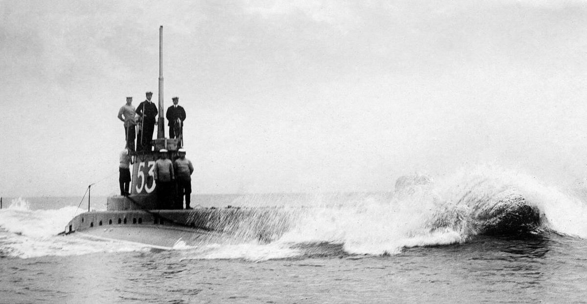 Officers and crew on the conning tower of HM Submarine C 23 as she makes her way out to sea, 1914.