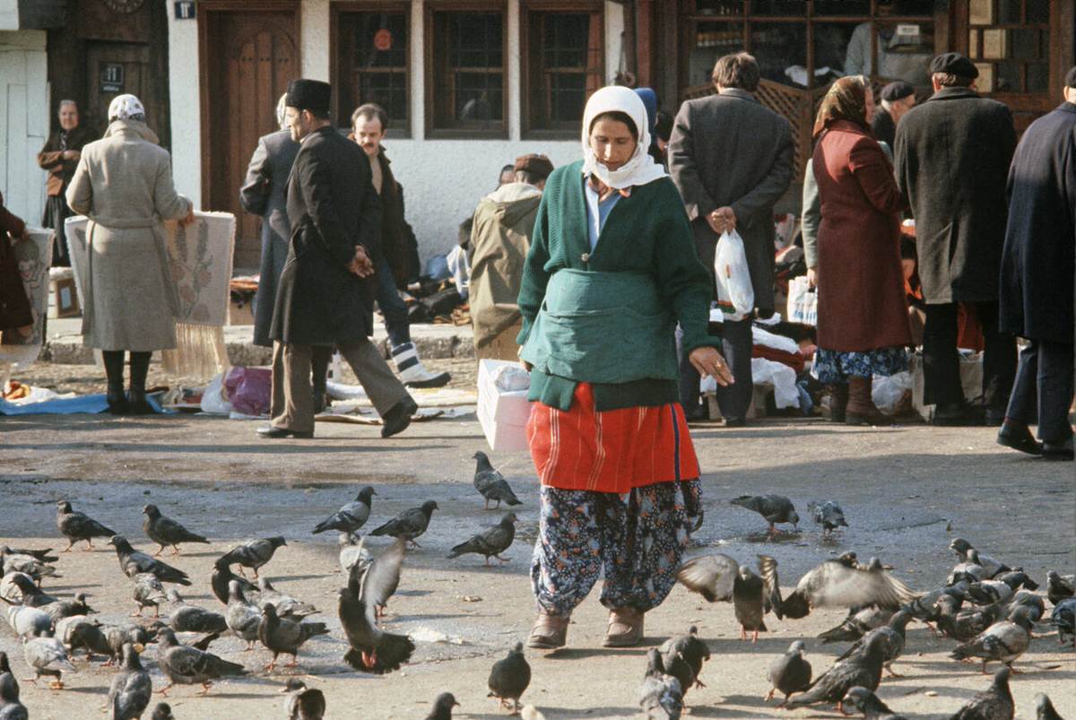 Muslim woman in traditional dress in historical market area of Sarajevo, former Yugoslavia, 1971.