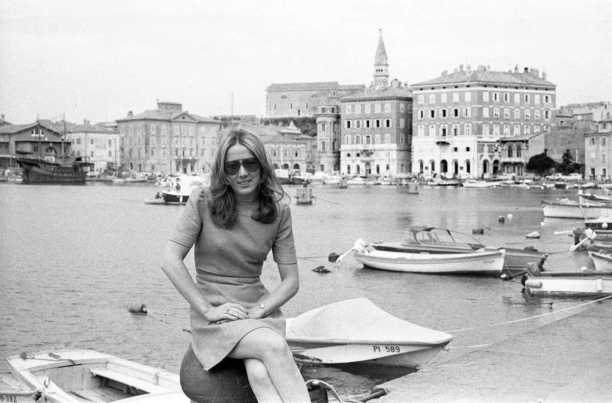 Female tourist in Piran Old Town Harbour, Slovenia, 1972.