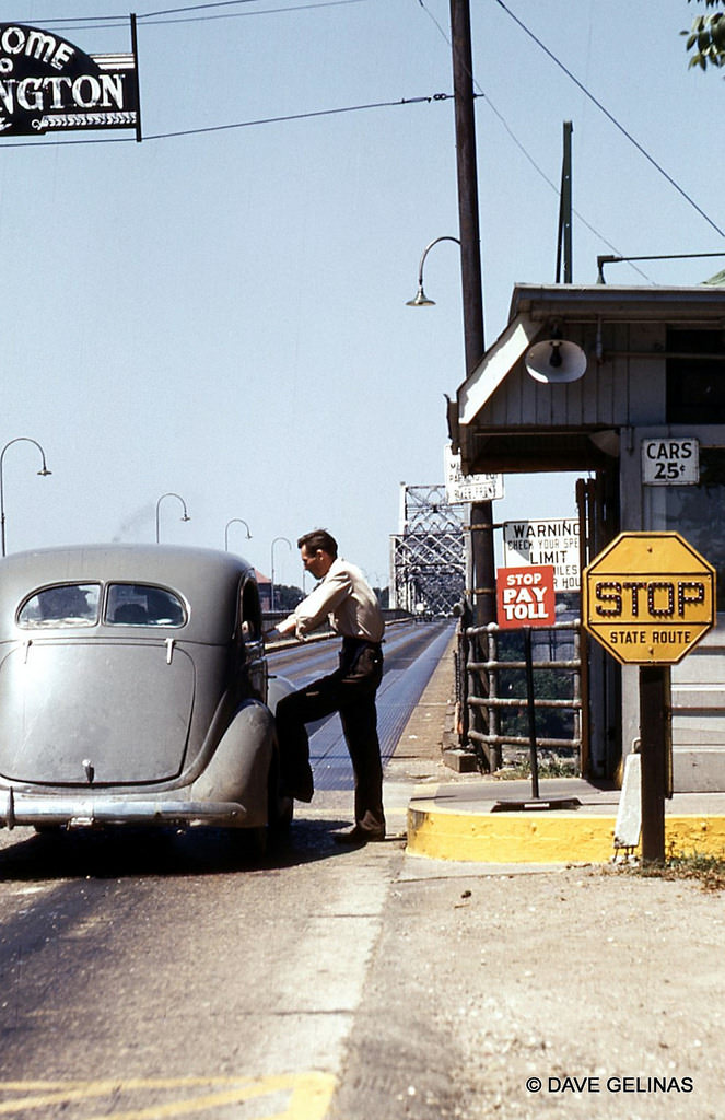 Toll Booth on a State Highway bridge with a vintage auto, 1940s