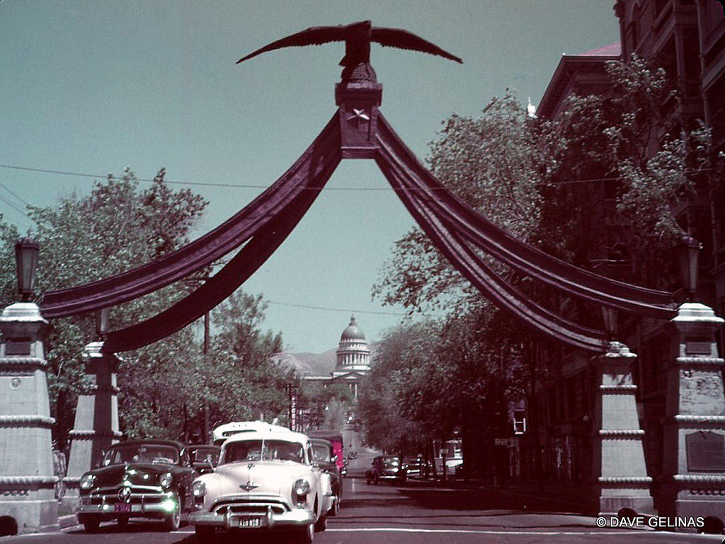 1949 Oldsmobile and 1949 Ford with Eagle Gate looking towards Capitol, Salt Lake City, Utah, 1949