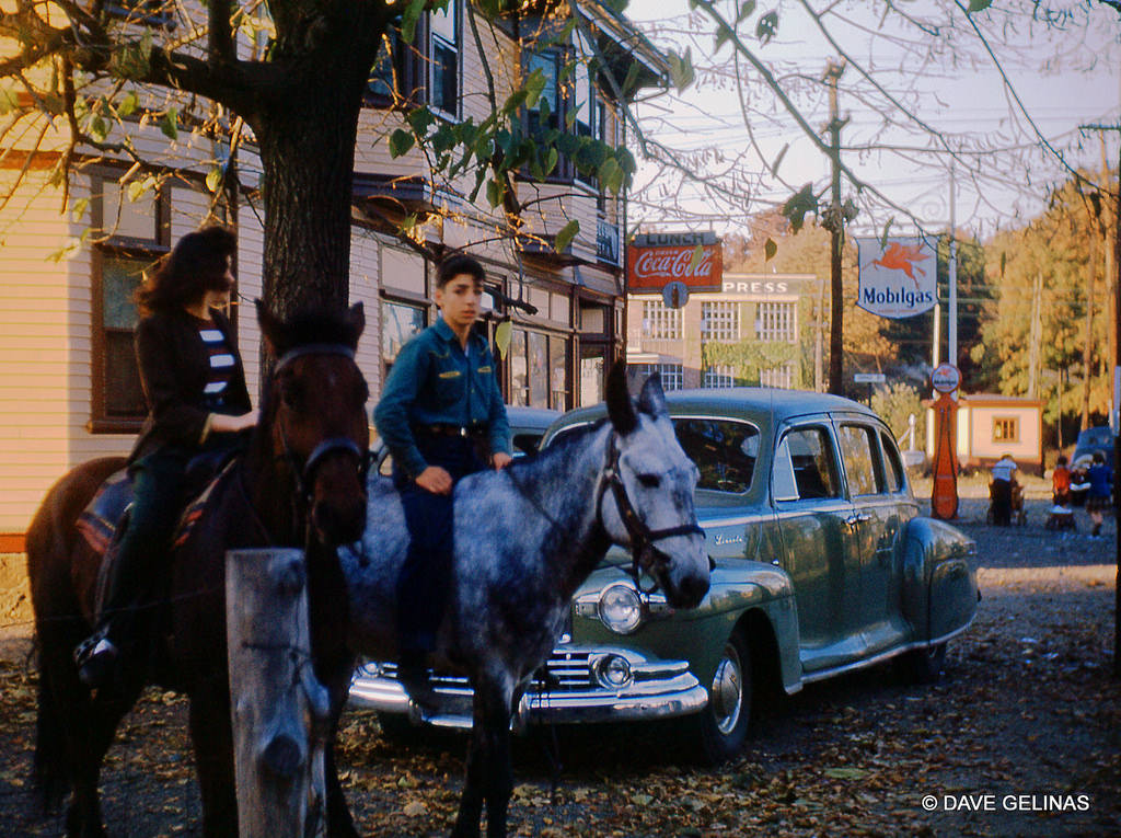 1947 Lincoln Zephyr with horseback riders, a Coca Cola Sign, and a Mobil Oil Gas Station and Sign, 1947