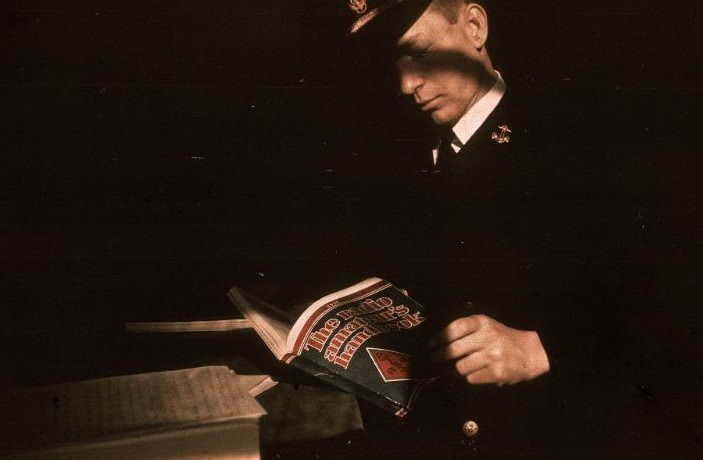 Man with the Radio Amateur's Handbook at the United States Naval Academy, Maryland, 1938