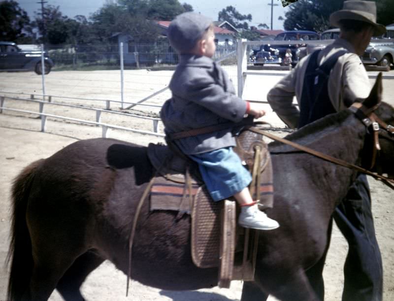 Pony rides off highway US 80 (now I-8) below the old William Templeton Johnson mansion, San Diego, California, 1947