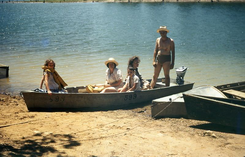 Family on a boat at a lake