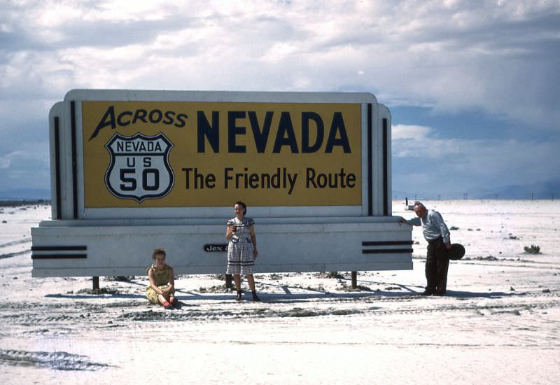 Family posing with Nevada US 50 Highway Sign, Nevada