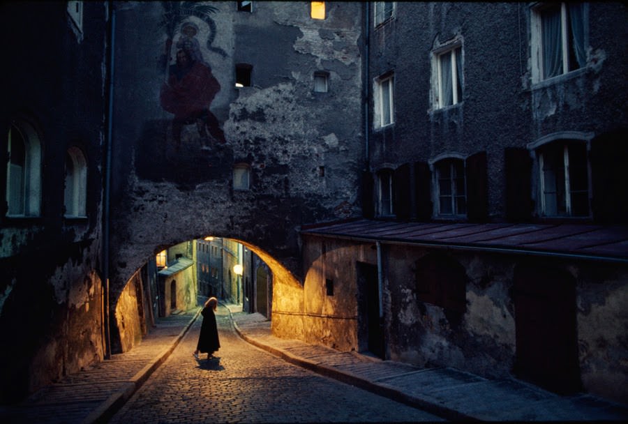 Statue of Saint Christopher decorating an archway over a cobblestone street in Bavaria, Germany, 1974