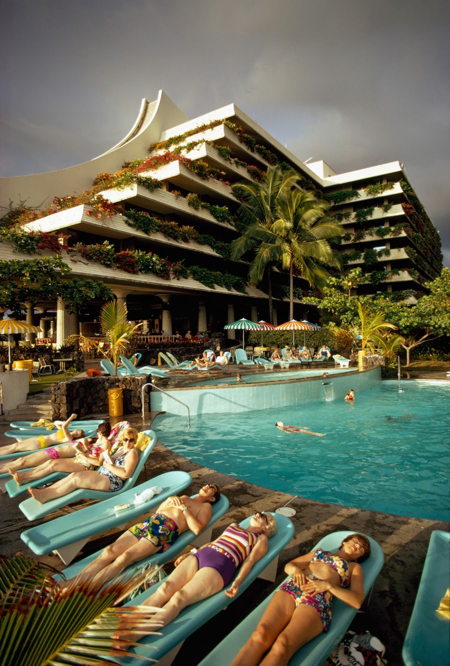 Vacationers lounging poolside at the Kona Hilton Resort in Kailua, Hawaii, 1975