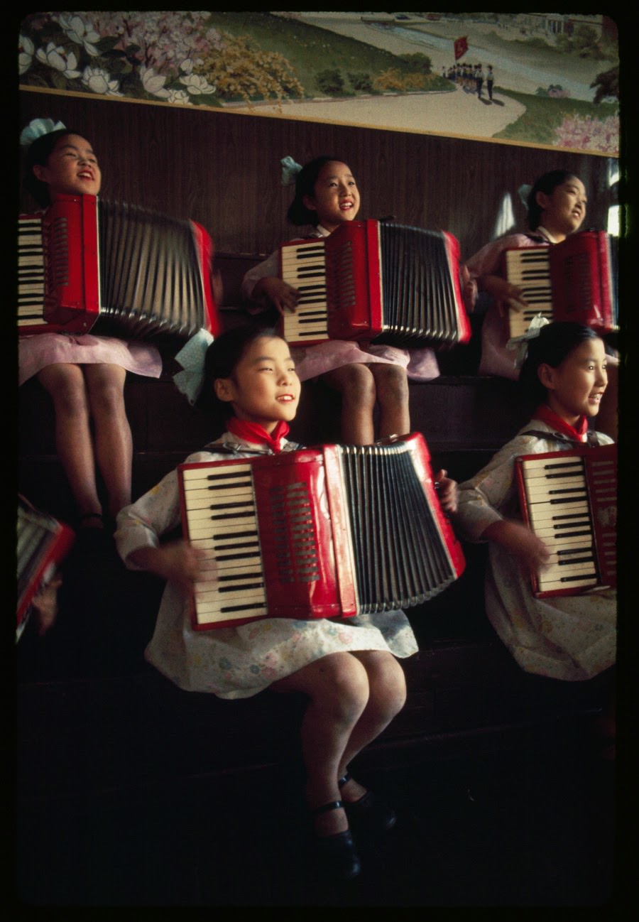 North Korean schoolgirls practicing the accordion, 1974