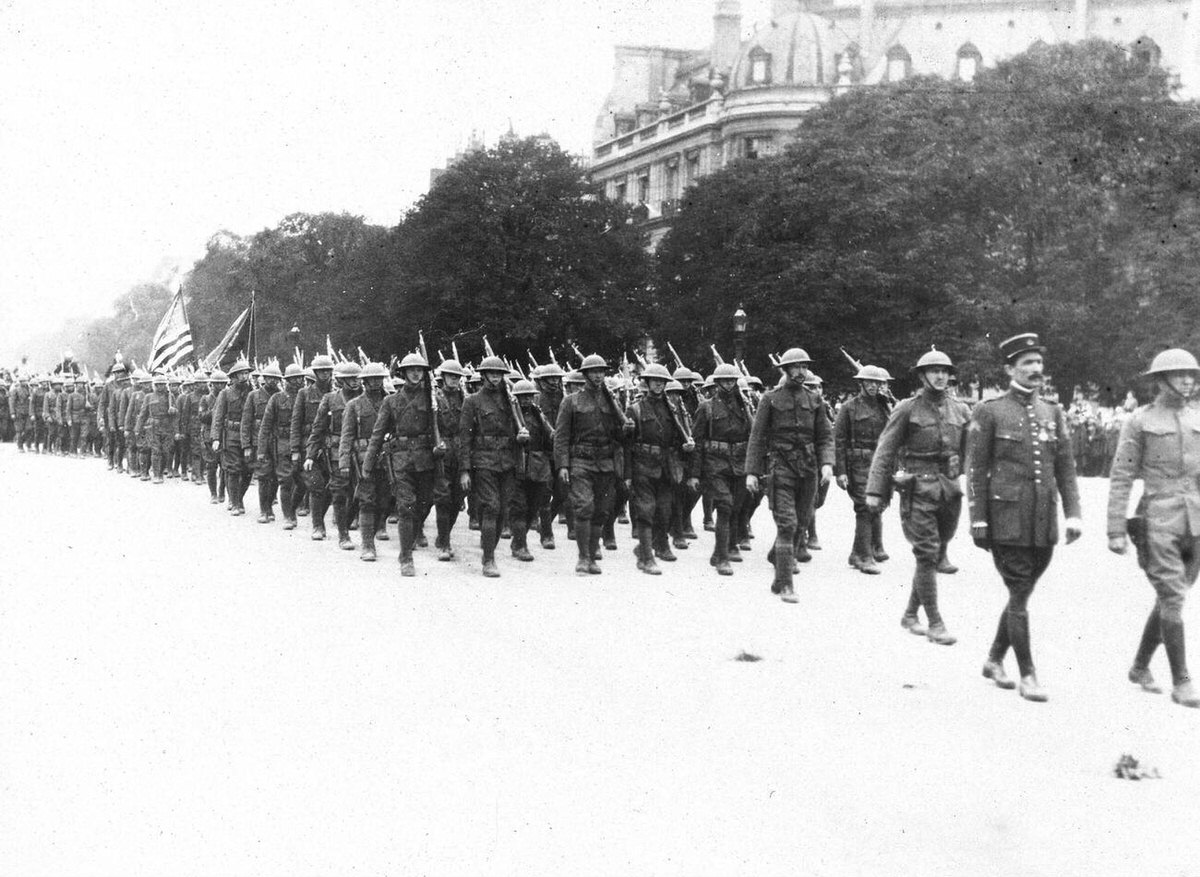 Americans marching down the Avenue des Champs-Élysées during an Independence Day celebration in Paris, 1918