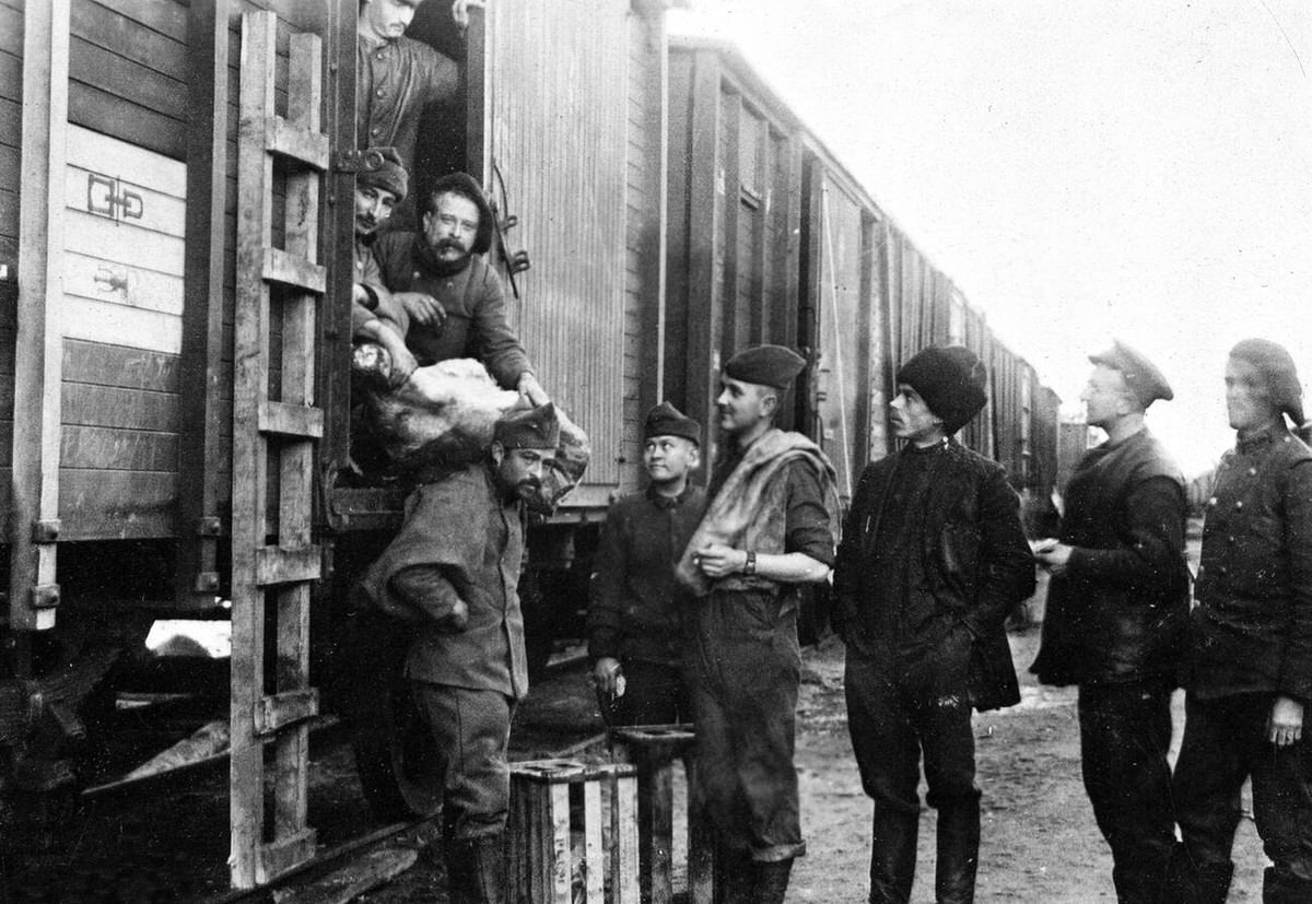 Allied troops drawing rations from a train on the Vologda Railway line in North Russia, 1918