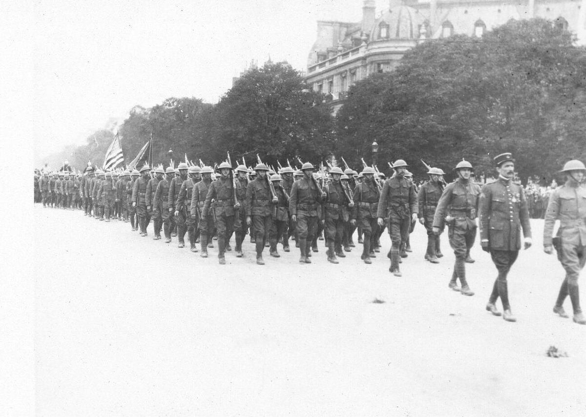 Americans marching down the Avenue des Champs-Élysées during an Independence Day celebration in Paris, 1918