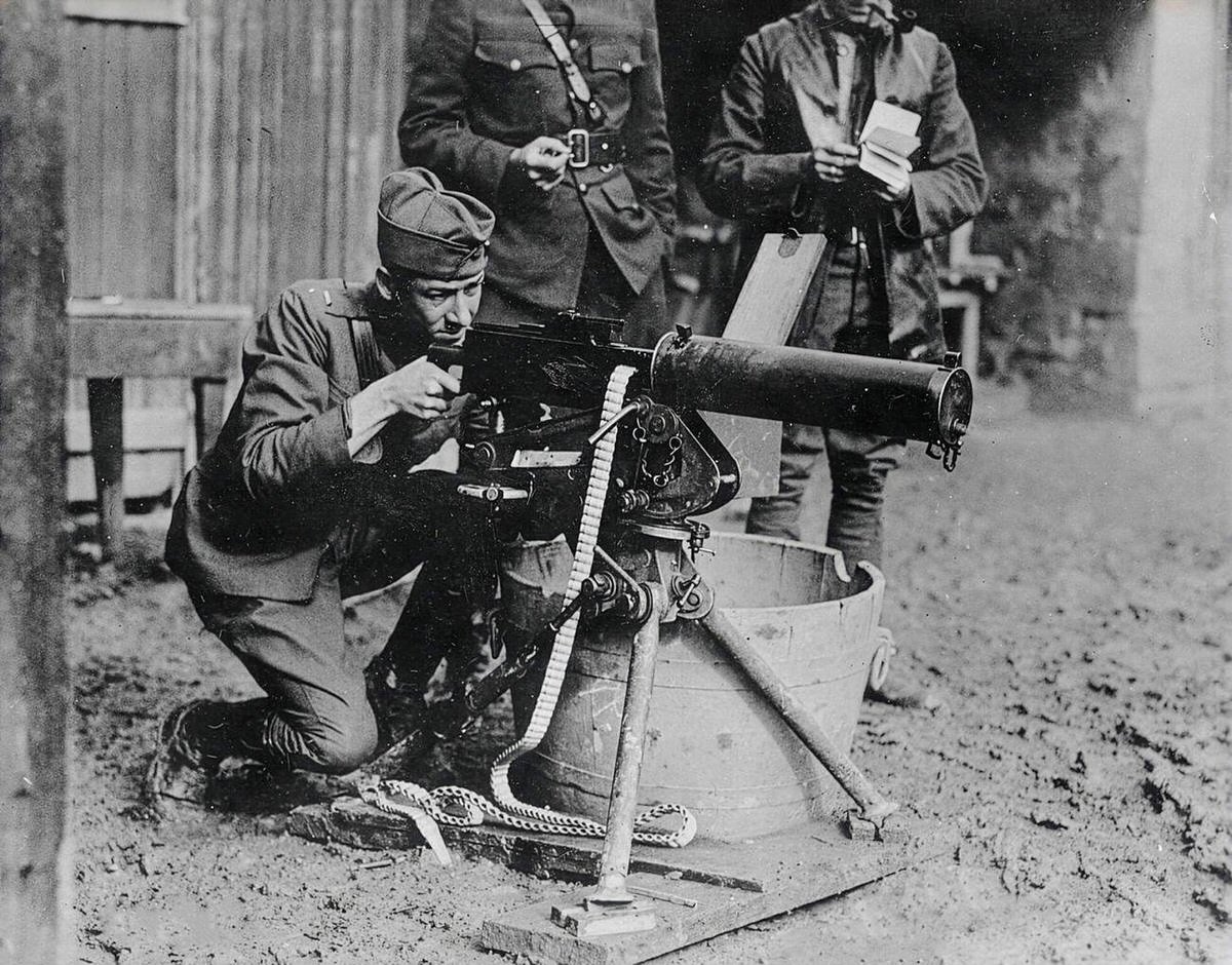 Lieutenant Valmore A. Browning testing an M1917 Browning machine gun at Thillombois, France, 1918