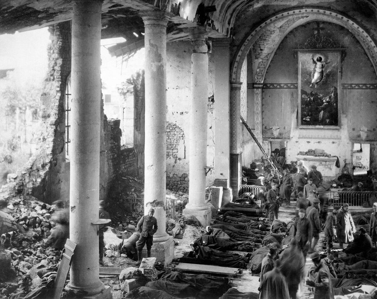 Temporary shelter in church ruins for American wounded treated by the 110th Sanitary Train in Neuvilly, France, 1918