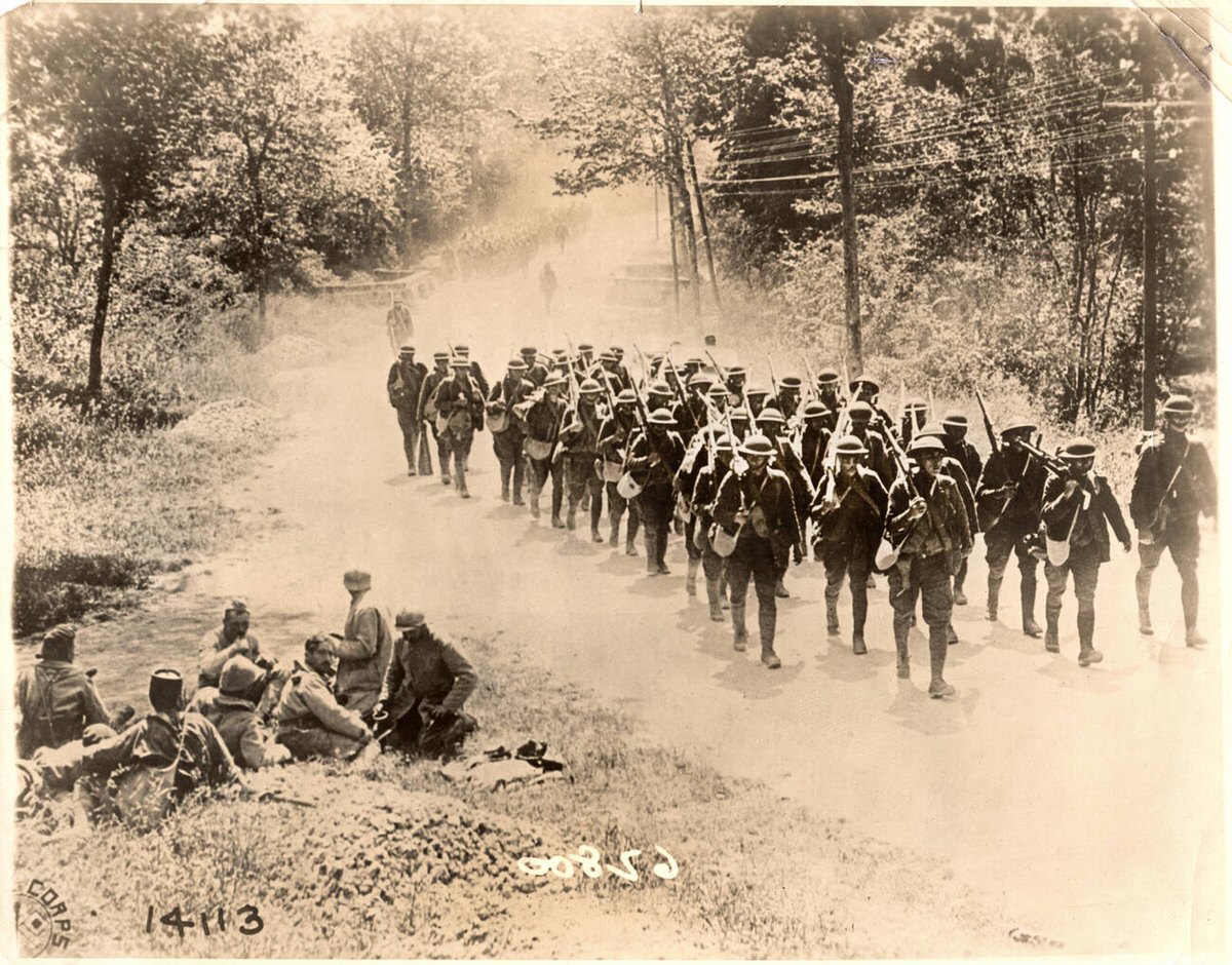 U.S. infantrymen marching to trenches in France, 1918