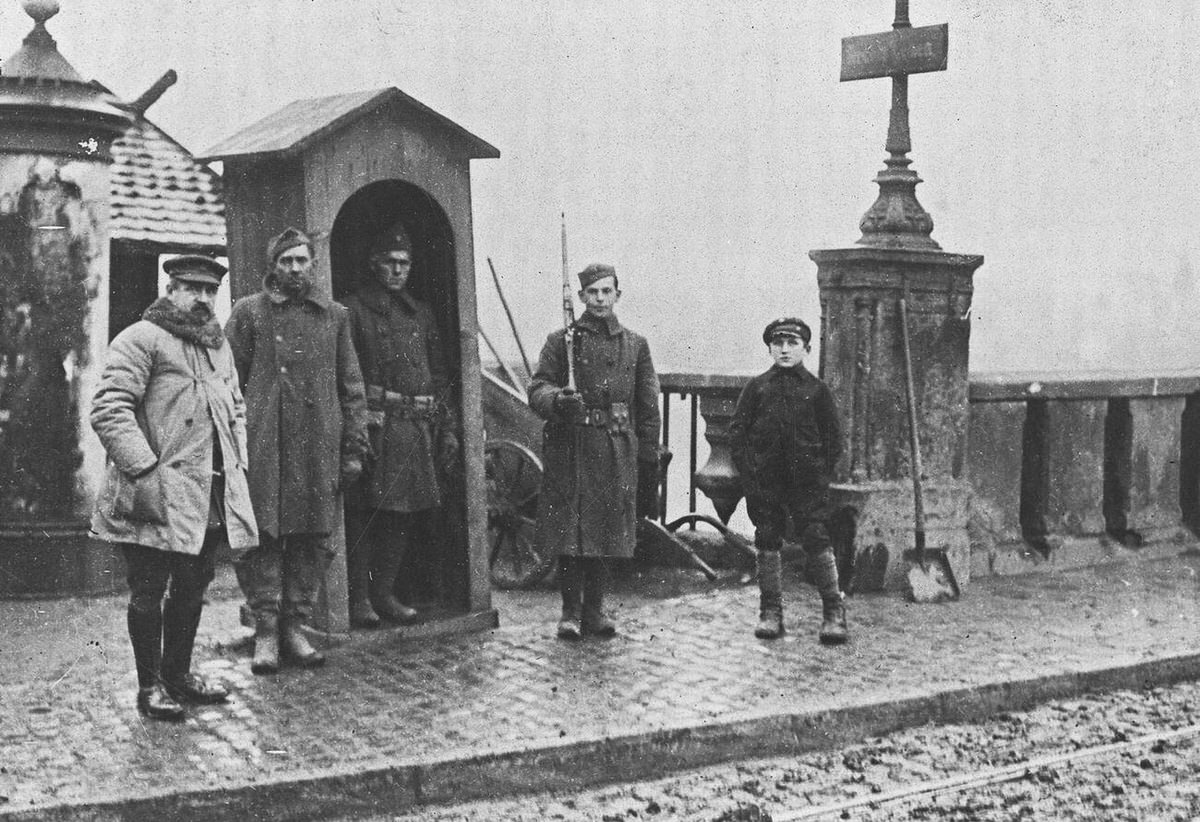American sentries of the Yankee Army of Occupation guarding a river bridge in Treves, Germany, 1919