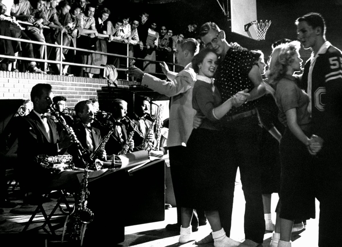 Students dancing at a weekly sock hop in the Carlsbad High School gym, 1954