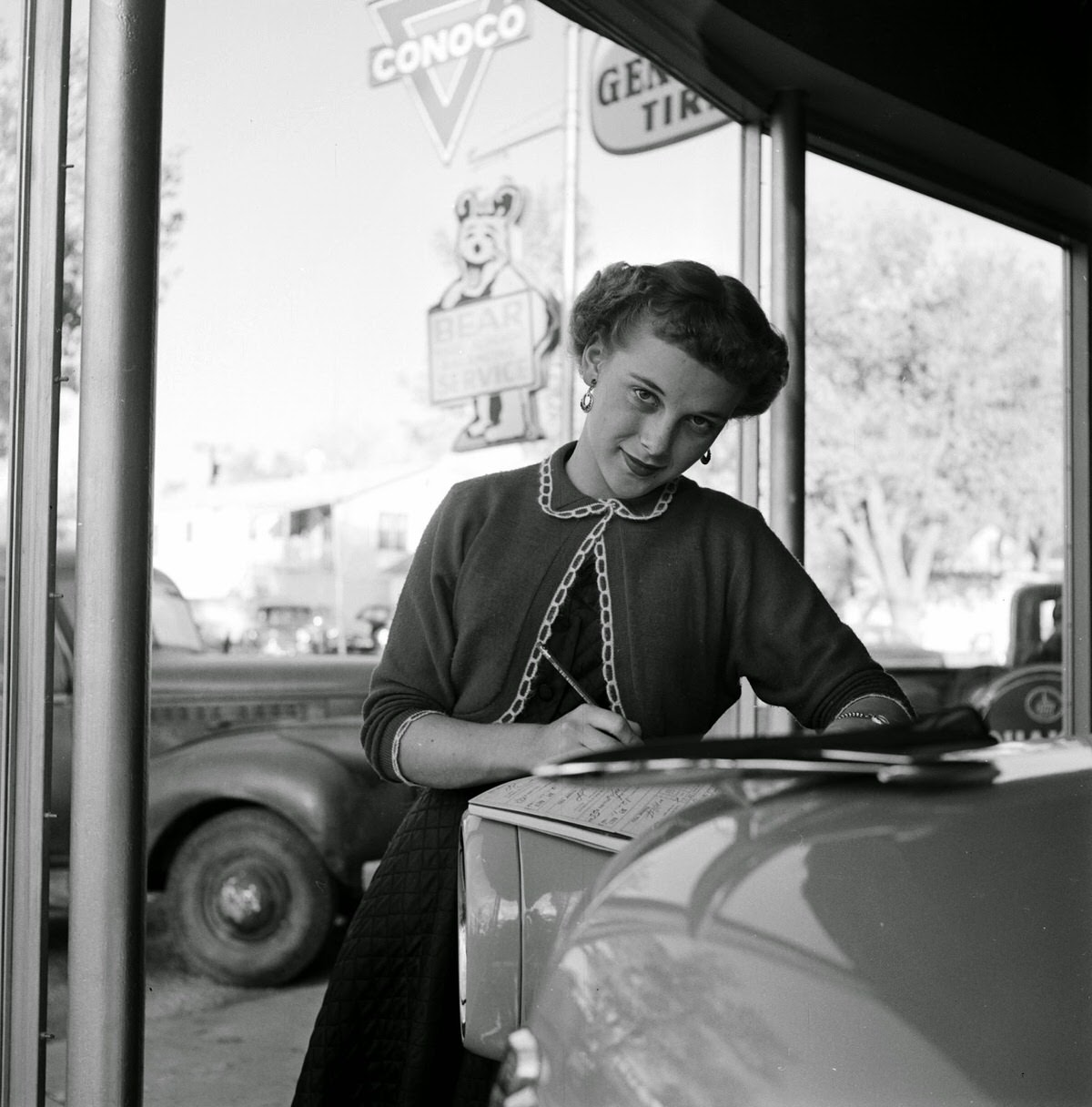 Rada Alexander working as a bookkeeper at an auto firm, 1954