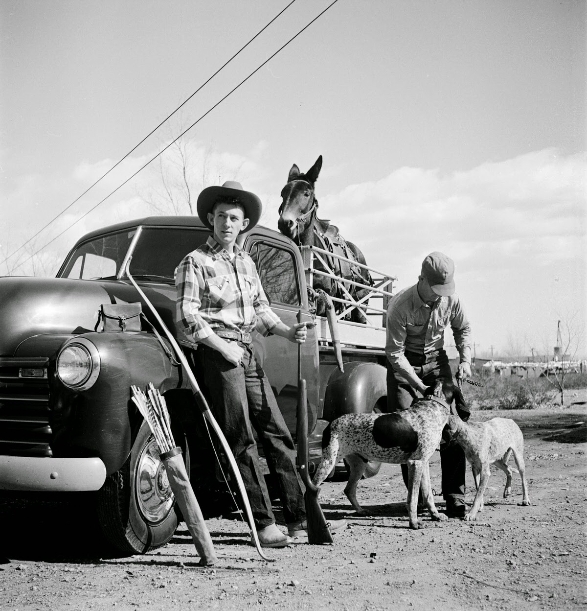 Sonny Thayer packing for a hunting trip, 1954