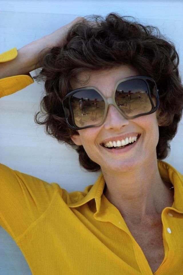 Audrey Hepburn wearing sunglasses during the filming of Robin and Marian, 1975