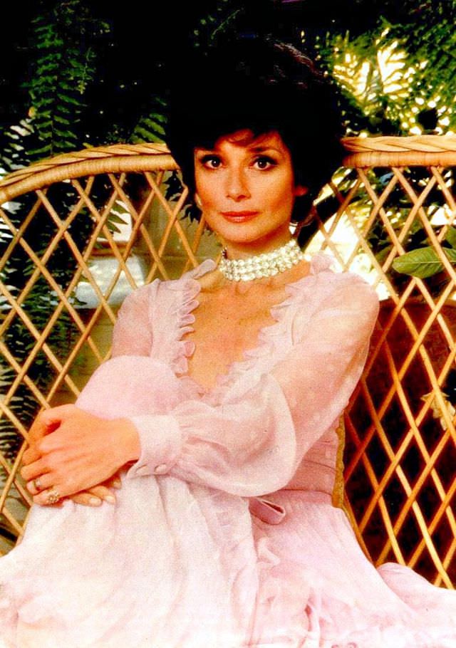 Audrey Hepburn wearing a Valentino pink dress at her Rome apartment, 1976