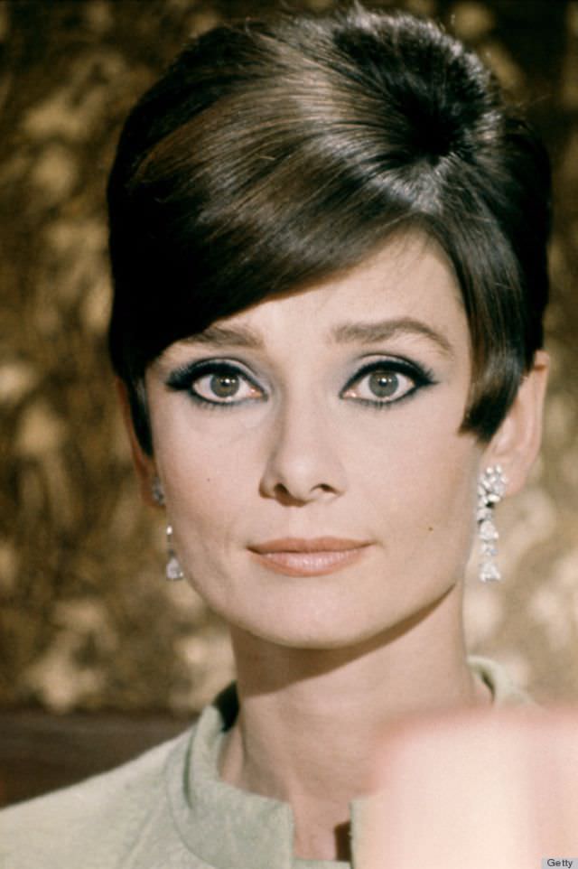 Expertly placed dark eyeliner can soften up a short haircut. Hepburn’s face always looked ultra feminine because she knew how to harness the power of great eye makeup.