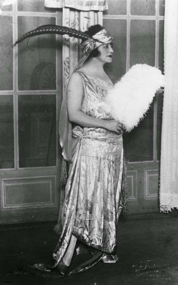 Nancy Spry of Winton in a dropped-waist floral print satin evening gown, 1920