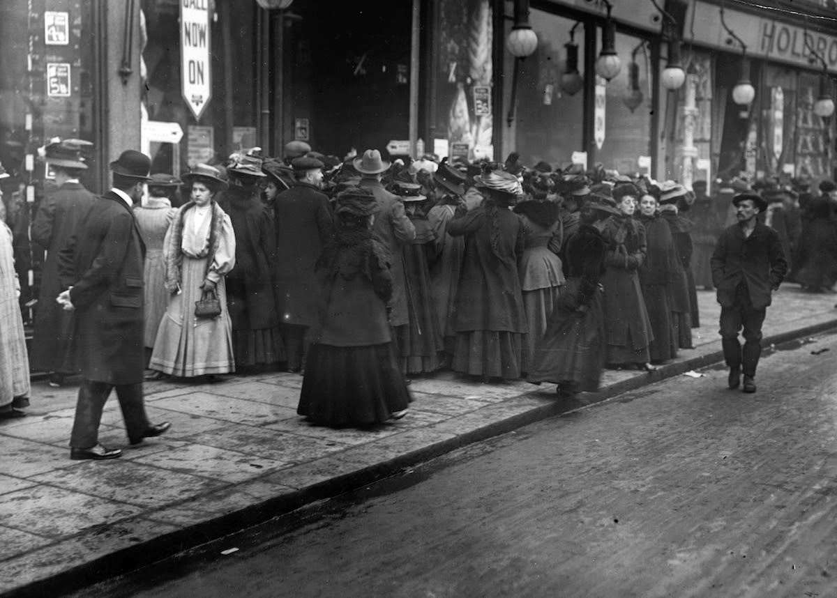 Bargain hunters waiting to enter a London shop during January sales, 1906