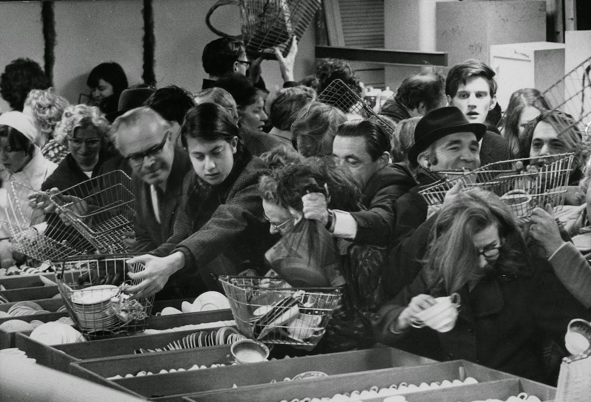 Bargain hunters at a display of china at Selfridges department store in London, 1965