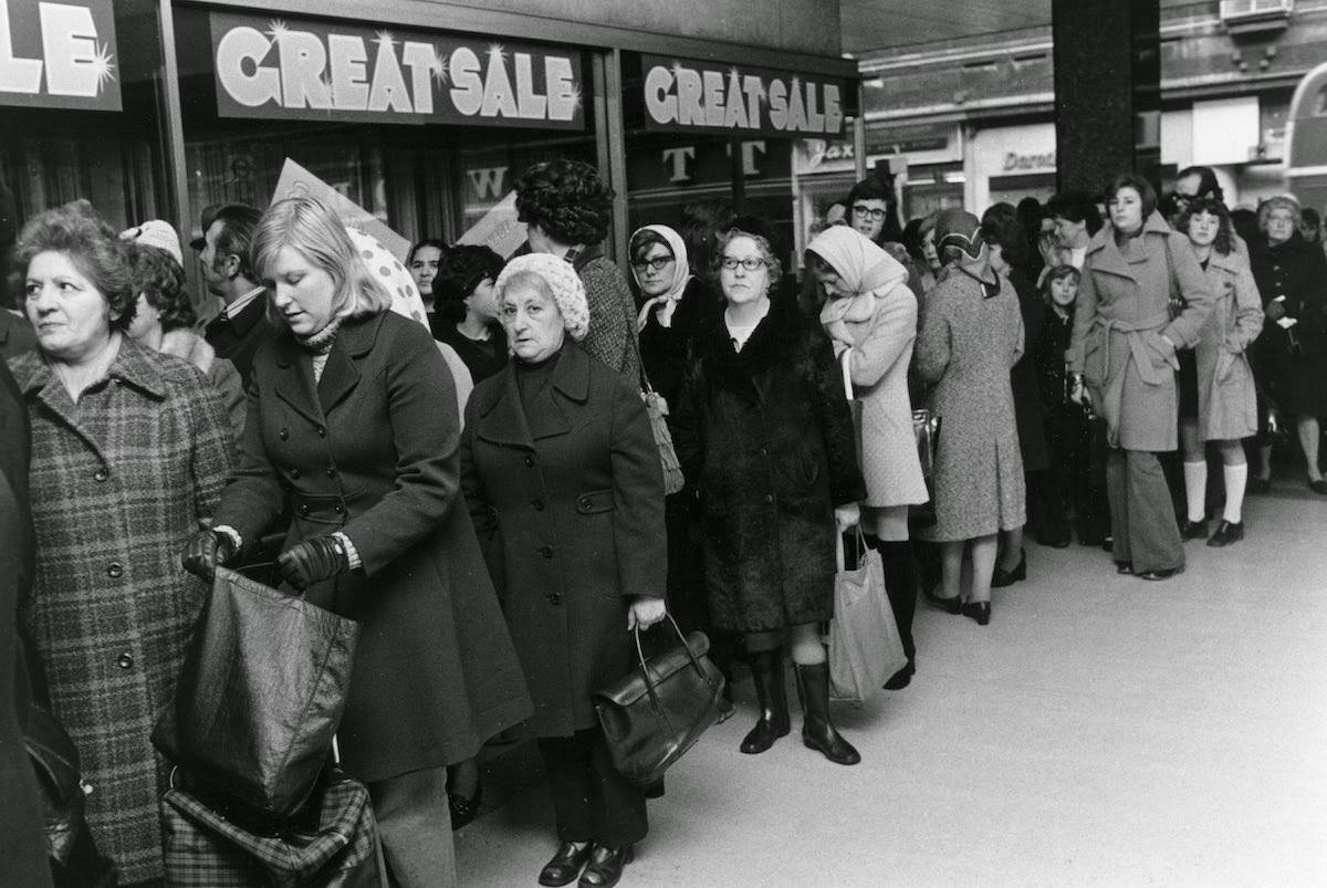Shoppers lining up for a sale at C&A department store in London, 1973