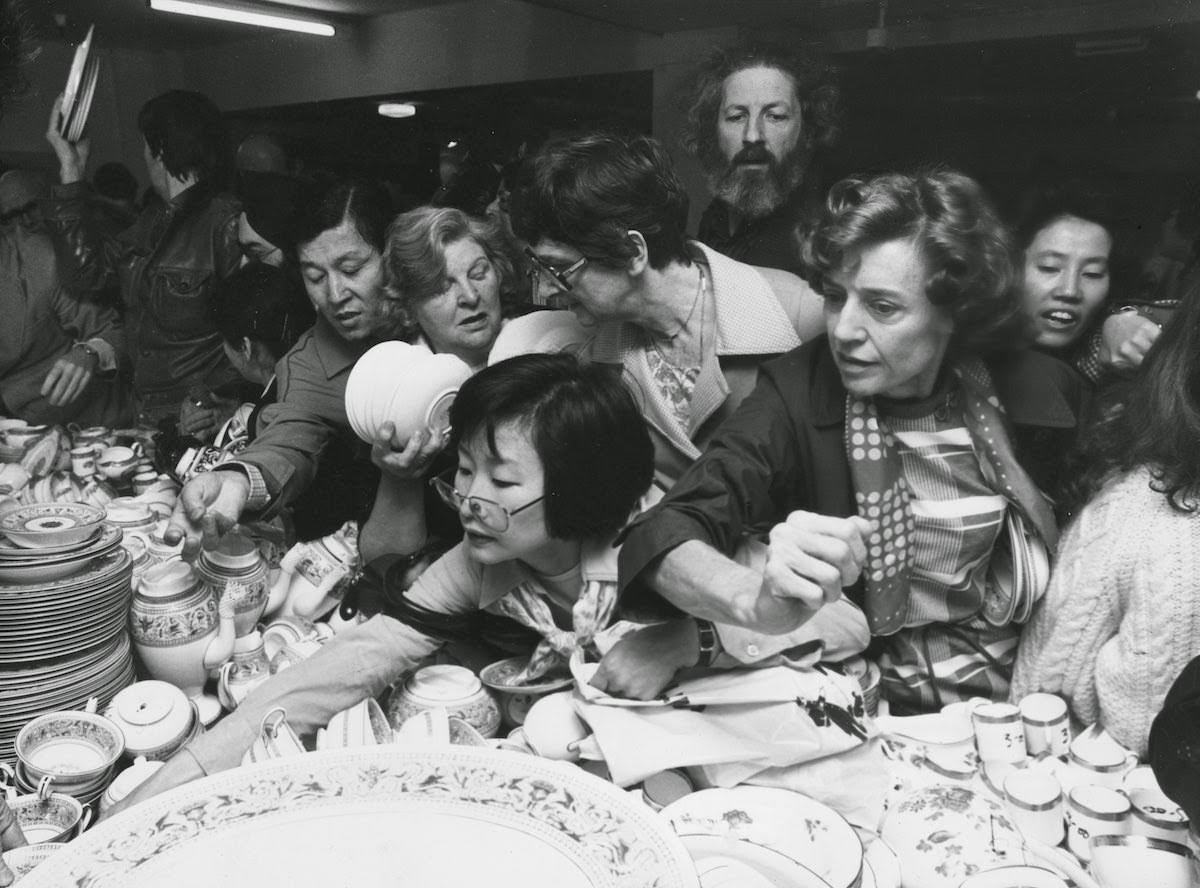 Crowd in the china department at a Harrods sale in London, 1980