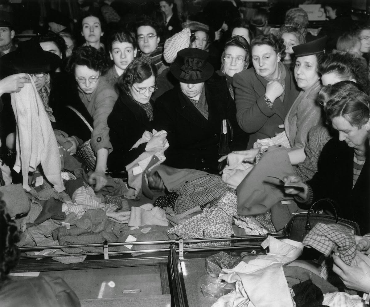 Bargain hunters shopping for hats during the January sales at Whiteley's department store in Bayswater, London, 1935