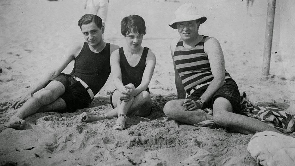 Composer Irving Berlin relaxing on Palm Beach with Anita Loos and Arthur Somers Roche, 1926