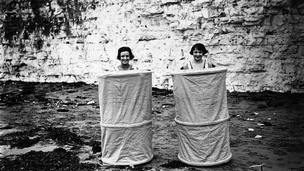 Two women using a skreenette at the beach, 1929