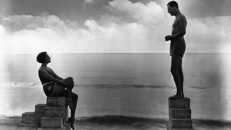 Actress Bebe Daniels with actor Ben Lyon at their California beach home, 1929