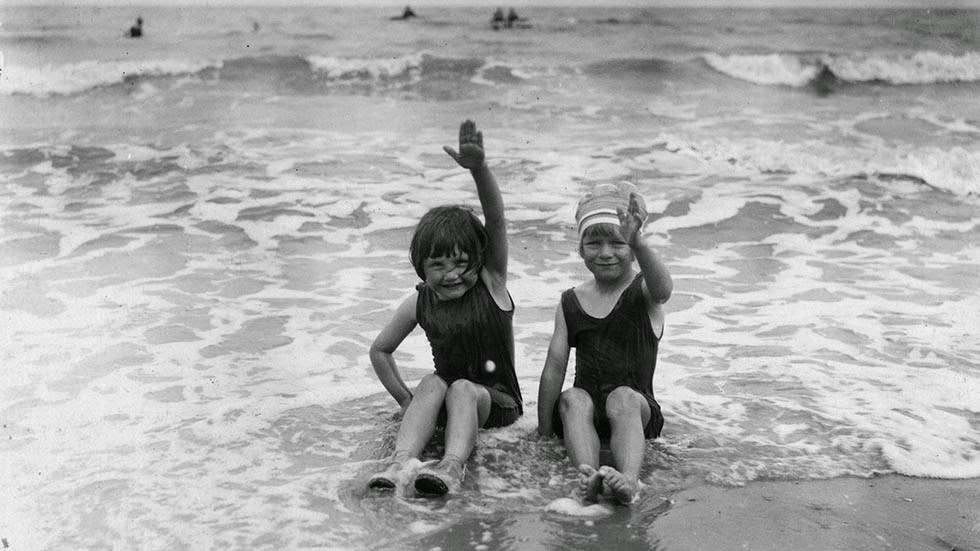 Two small bathers on the water's edge at Lowestoft, Suffolk, 1926