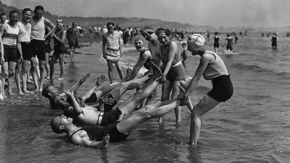 Group of women dragging men into the sea at Shanklin, Isle of Wight, 1929