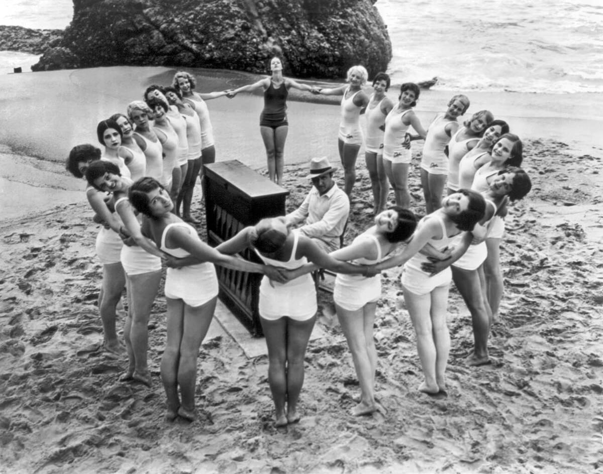 Albertina Rasch ballet rehearsing on the beach with Dimitry Tiomkin in Santa Monica, California, 1925