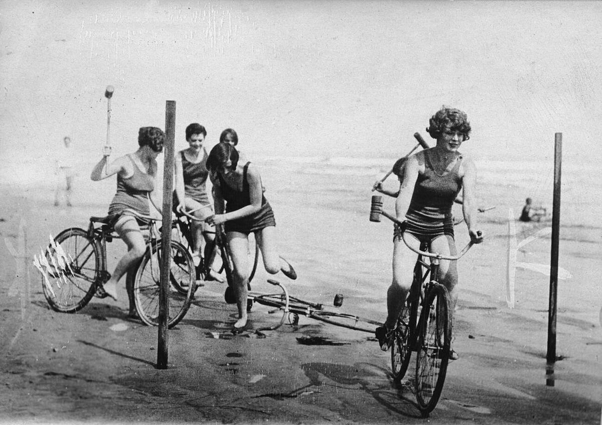 Young women playing cycle polo on the beach at Long Beach, California, 1926
