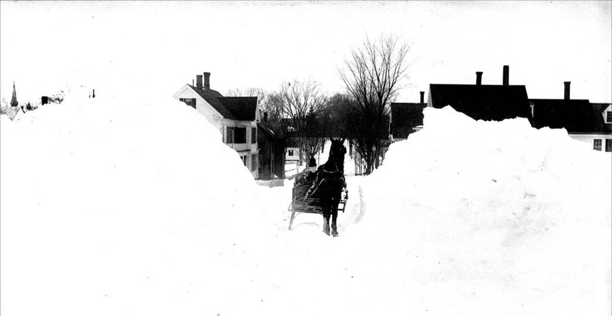 Massive snowdrifts near the cemetery in Keene, New Hampshire during the Blizzard of March, 1888.