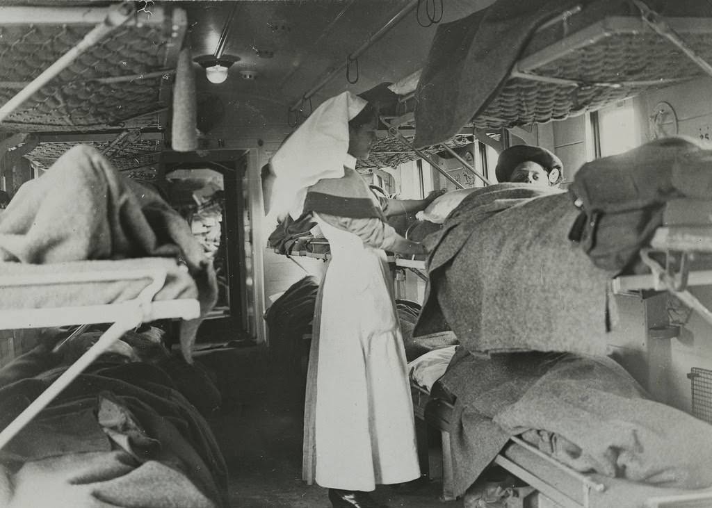The German offensive - A sister attending to gassed men on the Ambulance Train, 1914.
